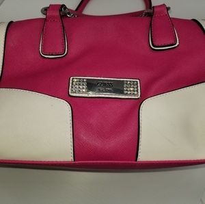 pink guess purse with charms